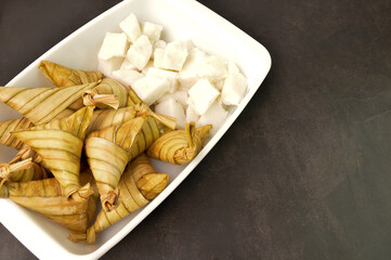 Malay traditional food called as Nasi Himpit and Ketupat rice or Ketupat Palas. Eaten with chicken rendang and served during Eid Mubarak
