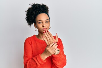 Young african american girl wearing casual clothes suffering pain on hands and fingers, arthritis...
