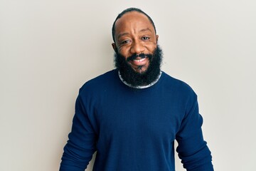 Young african american man wearing casual clothes with a happy and cool smile on face. lucky person.