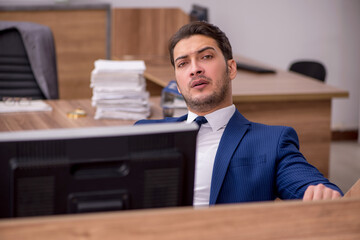 Young businessman employee working in the office