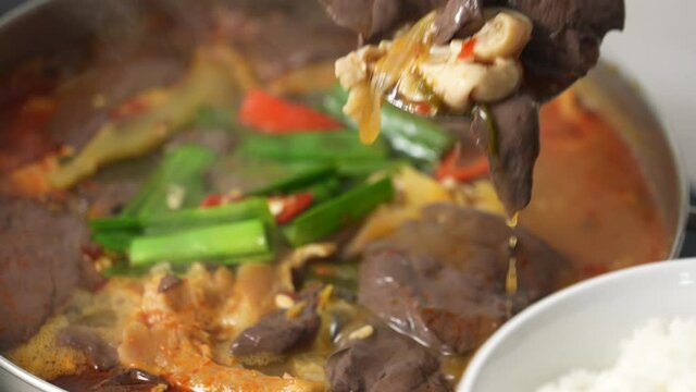 Pig intestine with duck blood. Taiwanese traditional spicy hot pot soup.