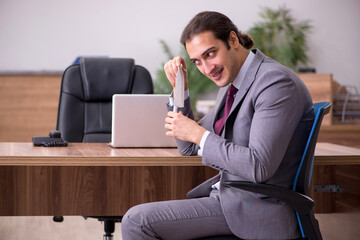 Young businessman employee in bullying concept in the office