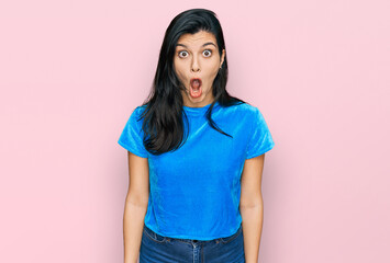 Young hispanic woman wearing casual clothes afraid and shocked with surprise expression, fear and excited face.