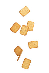 Cracker cookies falling isolated on white background with clipping path.