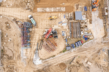 outdoor warehouse at construction site. parts of tower crane, materials and equipment. aerial top...