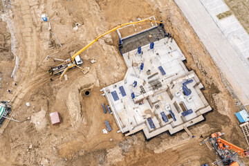 construction of multistory apartment building. zero cycle construction work. top view from drone
