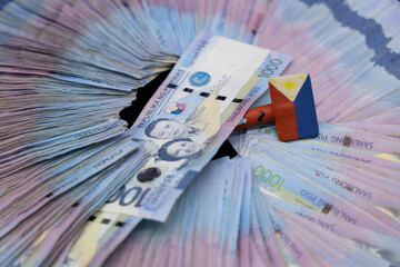 A pile of one thousand Philippines peso banknotes. Cash of Thousand dollar bills, Peso background...