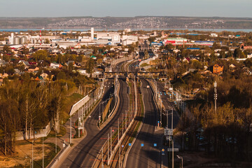 Fototapeta premium a long multi-lane road passes through the new blocks of the city of Kazan