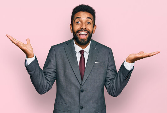 Young African American Man Wearing Business Clothes Celebrating Crazy And Amazed For Success With Arms Raised And Open Eyes Screaming Excited. Winner Concept