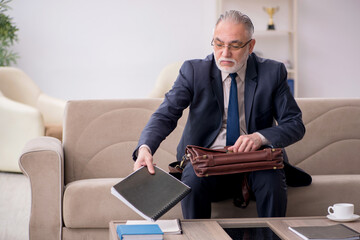 Old businessman employee waiting for business meeting
