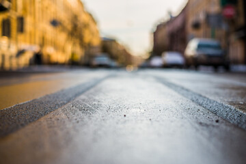 City streets late autumn, the empty street. Close up view from the pedestrian crossing level