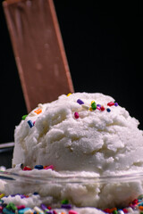 cream ice cream with colored sprinkles