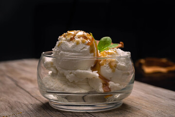 cream ice cream with dulce de leche caramel and wafer