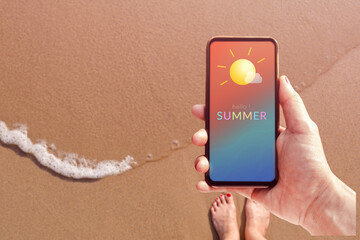 Summer Time Concept. Woman holding Mobile Phone with Summer Message and Icon Weather. Sand Beach...