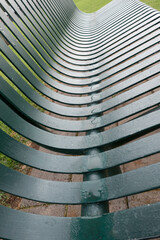 close up of park bench with water