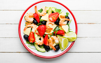 Summer salad with shrimps and strawberries,top view