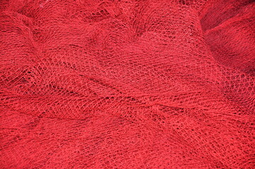 Red fishing Nets Textured Background. Fisher net close up. Colourfoul Fisher net close-up and details. 