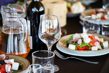 Salad of cheese, paprika, onions, olives on a banquet table in a restaurant.