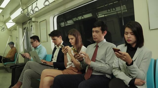 internet of thing ,On the subway, people use their phones to communicate on social media, virtual worlds.
