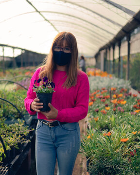 woman watering flowers