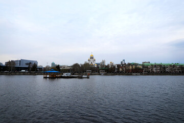 Naklejka premium City in the evening. View from the embankment of the city