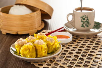 Siu Mai - Chinese steamed pork dumplings in bamboo steamers. Dim Sum