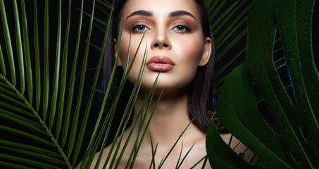 young woman in Jungle. beautiful girl in palms