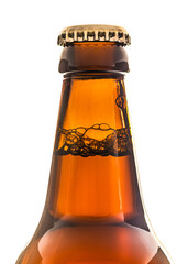Neck of a brown beer bottle with cap showing the bubbles on a white background