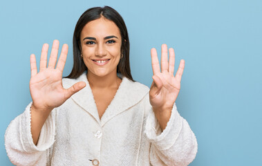 Young brunette woman wearing casual clothes showing and pointing up with fingers number nine while...