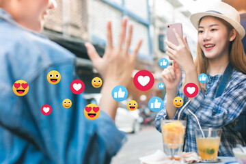 Traveler Asian blogger women and friend  travel in Bangkok, Thailand, beautiful female using mobile phone.Social media interactions on mobile phone with notification icons.