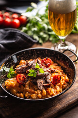 Italian gnocchi in tomato sauce, served with sous vide beef and topped with fresh parsley