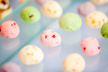 Colorful shortbreads are placed on the snack table of a Western-style outdoor wedding