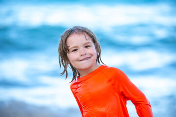 Happy kids boy play in the sea.