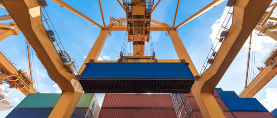 crane loading container box to container cargo freight ship in port shipping containers a logistics...