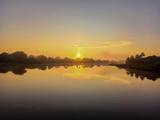 Sunrise at the edge of the river
