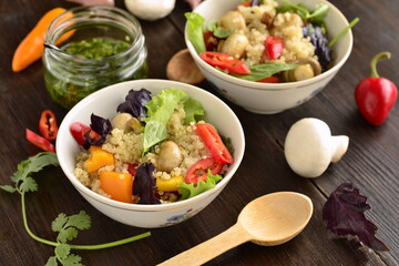 Salad with quinoa, sweet pepper, mushrooms, herbs and pistachios. Healthy nutrition. Vegetarian concept.