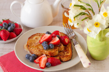 Breakfast with french toast and berry fruits