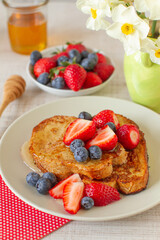 Breakfast with french toast and berry fruits