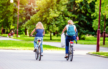 Cyclists ride on the bike path in the city Park
