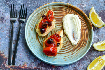 Keto caprese chicken .Grilled chicken with mozzarella cheese,olives  basil and tomatoes with celery puree. Ketogenic diet food