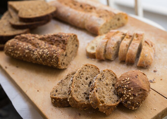 fresh loaf of bread on wooden board