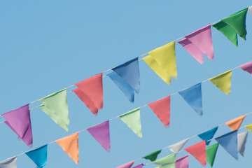 Background from triangular flags. Festive garland for interior decoration.