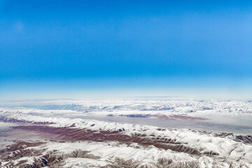 Fototapeta premium Aerial photos of Plateau and snow mountain in Xinjiang, China