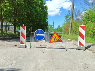 Road Maintenance Warning Signs and Detour Route.