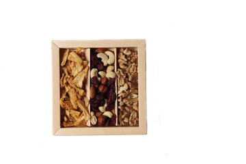 healthy eating food - a box of fruit mix and dried pineapple isolated on white background flat lay