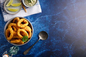Fresh homemade calamari with homemade tartar sauce and lemon.
