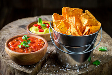 Nachos with spicy sauce. Mexican snack popular in the cinema.
