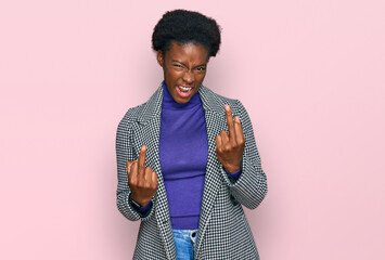 Young african american girl wearing casual clothes showing middle finger doing fuck you bad...