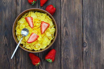healthy breakfast and snack, cornflakes with strawberry fruit, summer healthy food and sweet dessert