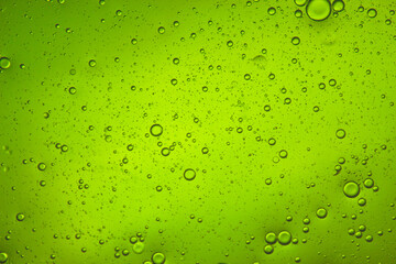 bright green liquid background of bubbles with movement - Powered by Adobe